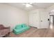 Bedroom with light wood floors and white walls, offering versatility for various uses at 7702 W Piute Ave, Glendale, AZ 85308