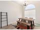 Dining room with a rustic wood table and modern decor at 7702 W Piute Ave, Glendale, AZ 85308