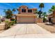 Two-story home featuring a spacious driveway and desert landscaping at 7702 W Piute Ave, Glendale, AZ 85308