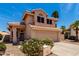 Charming two-story home featuring a spacious driveway and desert landscaping at 7702 W Piute Ave, Glendale, AZ 85308