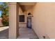 Inviting front porch with security door and neutral color scheme at 7702 W Piute Ave, Glendale, AZ 85308