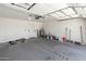 Spacious garage with ample storage and room for multiple vehicles at 7702 W Piute Ave, Glendale, AZ 85308