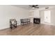Cozy living room featuring a fireplace and wood-look floors at 7702 W Piute Ave, Glendale, AZ 85308