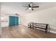 Expansive living room with laminate floors and neutral walls at 7702 W Piute Ave, Glendale, AZ 85308