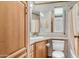 Compact bathroom featuring a vanity with a sink, a toilet, a mirror, and a shower with a curtain at 838 Aquamarine Dr, Apache Junction, AZ 85119