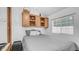 Cozy bedroom featuring light wood cabinets and window, providing natural light above a comfortable bed at 838 Aquamarine Dr, Apache Junction, AZ 85119