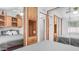 Bedroom with a mirror showing built-in cabinets, offering ample storage and a clean, mirrored closet at 838 Aquamarine Dr, Apache Junction, AZ 85119