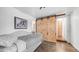 Cozy living space with barn doors that compliments the hardwood floors at 838 Aquamarine Dr, Apache Junction, AZ 85119