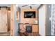 Living room featuring modern laminate flooring, a cozy fireplace, and a wall-mounted television at 838 Aquamarine Dr, Apache Junction, AZ 85119