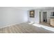 Well-lit bedroom boasts laminate flooring, ample space, and access to the bathroom at 9275 E Mission Ln # 206, Scottsdale, AZ 85258