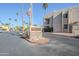 Exterior shot of the community sign with the American flag waving in the background at 9275 E Mission Ln # 206, Scottsdale, AZ 85258