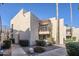 Attractive condo with private balcony, desert landscaping and inviting curb appeal on a sunny day at 9275 E Mission Ln # 206, Scottsdale, AZ 85258