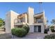 Charming two-story condo with inviting balconies, desert landscaping, and attractive architectural details at 9275 E Mission Ln # 206, Scottsdale, AZ 85258