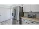 Modern kitchen with stainless steel refrigerator and ample counter space is perfect for meal preparation and storage at 9275 E Mission Ln # 206, Scottsdale, AZ 85258