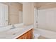 Bathroom with vanity, toilet, and shower/tub combo with white tile surround at 10136 E Southern Ave # 1052, Mesa, AZ 85209