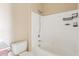 Close up of a bathtub with white tile surround and shower, with toilet to the left at 10136 E Southern Ave # 1052, Mesa, AZ 85209