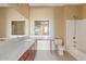 Bathroom featuring a vanity with a large mirror, tiled floors, and a bathtub with shower at 10136 E Southern Ave # 1052, Mesa, AZ 85209