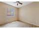 Bedroom with neutral carpeting, a ceiling fan and a window with a view to the outside at 10136 E Southern Ave # 1052, Mesa, AZ 85209