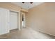Bedroom features neutral carpeting, closet, and an entrance to the kitchen at 10136 E Southern Ave # 1052, Mesa, AZ 85209