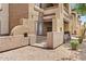 Multi-level condo building showcasing a clean exterior with neutral colors, complemented by desert landscaping at 10136 E Southern Ave # 1052, Mesa, AZ 85209