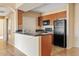 Functional kitchen features stone countertops, wood cabinets, and appliances at 10136 E Southern Ave # 1052, Mesa, AZ 85209