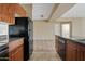 Kitchen features wood cabinets and stone countertops at 10136 E Southern Ave # 1052, Mesa, AZ 85209