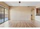 Bright living room with wood flooring and a sliding glass door at 10136 E Southern Ave # 1052, Mesa, AZ 85209