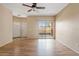 Living room with wood flooring, sliding glass door and ceiling fan at 10136 E Southern Ave # 1052, Mesa, AZ 85209