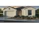 Beautiful one-story stucco home featuring desert landscaping, a two-car garage, and a tiled roof at 10155 W Columbus Ave, Avondale, AZ 85392