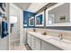 Bathroom featuring double vanity, modern fixtures, and decorative mirrors at 10838 N 10Th St, Phoenix, AZ 85020