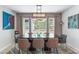 Bright dining room featuring a modern chandelier and backyard views at 10838 N 10Th St, Phoenix, AZ 85020
