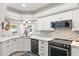 Modern kitchen featuring white cabinetry, stainless steel appliances, and granite countertops at 10838 N 10Th St, Phoenix, AZ 85020