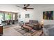 Inviting living room with ceiling fan, wood-look floors and a spacious dining area at 10838 N 10Th St, Phoenix, AZ 85020