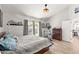 Well-lit main bedroom with exercise equipment, direct outdoor access, and modern furniture at 10838 N 10Th St, Phoenix, AZ 85020