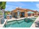 A sparkling pool with a built-in grill and patio area is perfect for entertaining at 10838 N 10Th St, Phoenix, AZ 85020