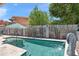 The clean blue pool in backyard features sculptures and landscaping in the background at 10838 N 10Th St, Phoenix, AZ 85020