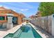The pool is nestled between the house and a wall with decorative elements at 10838 N 10Th St, Phoenix, AZ 85020