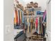 Spacious walk-in closet with ample storage shelves and hanging rods for organization at 10838 N 10Th St, Phoenix, AZ 85020