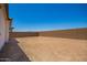 Large dirt lot back yard with a block wall is ready for your landscape ideas at 11408 S 50Th Ln, Laveen, AZ 85339