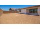Backyard with dirt and block wall with covered patio at 11408 S 50Th Ln, Laveen, AZ 85339
