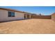 Backyard with dirt and block wall with covered patio at 11408 S 50Th Ln, Laveen, AZ 85339