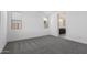 Bedroom features neutral-colored walls, carpet, and an ensuite bathroom at 11408 S 50Th Ln, Laveen, AZ 85339