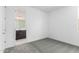 Bedroom with neutral carpet, baseboards, and paint, that transitions to a bathroom at 11408 S 50Th Ln, Laveen, AZ 85339