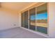 Covered patio with large sliding glass doors and recessed lighting at 11408 S 50Th Ln, Laveen, AZ 85339