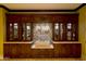 Custom built-in shelves with decorative items on display provide an aesthetic and practical space for a business at 116 E Santa Lucia Ln, Queen Creek, AZ 85140