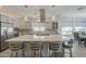 Open-concept kitchen with a large island, stainless steel appliances, and pendant lighting fixtures at 116 E Santa Lucia Ln, Queen Creek, AZ 85140