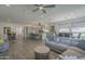 An open floor plan featuring a kitchen, living room, and dining area for seamless flow and modern living at 116 E Santa Lucia Ln, Queen Creek, AZ 85140