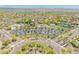 Expansive aerial view showcasing community amenities like the pool, park, and tennis court at 11875 W Lone Tree Trl, Peoria, AZ 85383