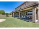 Spacious covered patio is perfect for outdoor dining and relaxing, overlooking the backyard and green space at 11875 W Lone Tree Trl, Peoria, AZ 85383