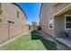 Well-maintained backyard featuring a green lawn and privacy fence at 11875 W Lone Tree Trl, Peoria, AZ 85383